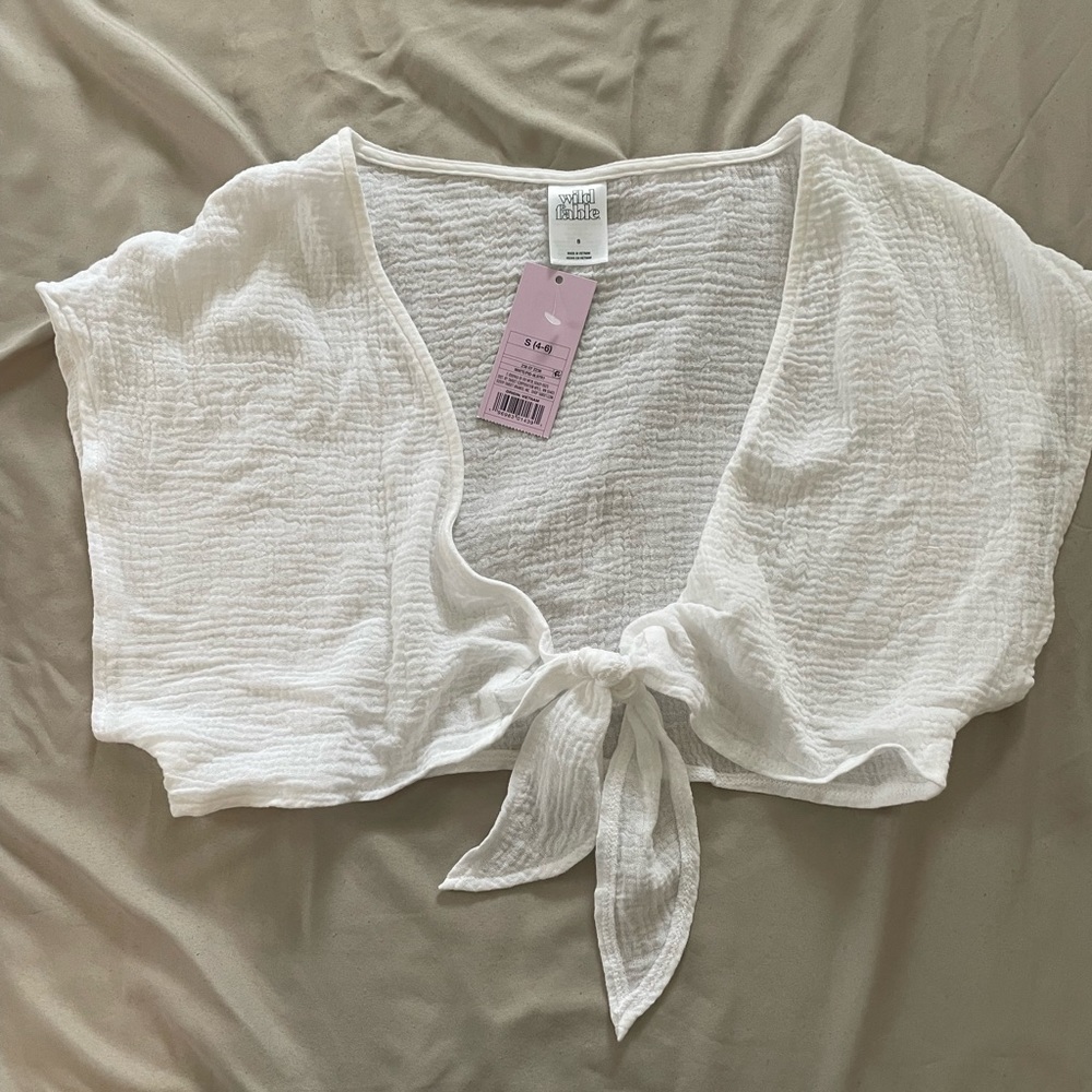 White bathing suit cover up tie front top.